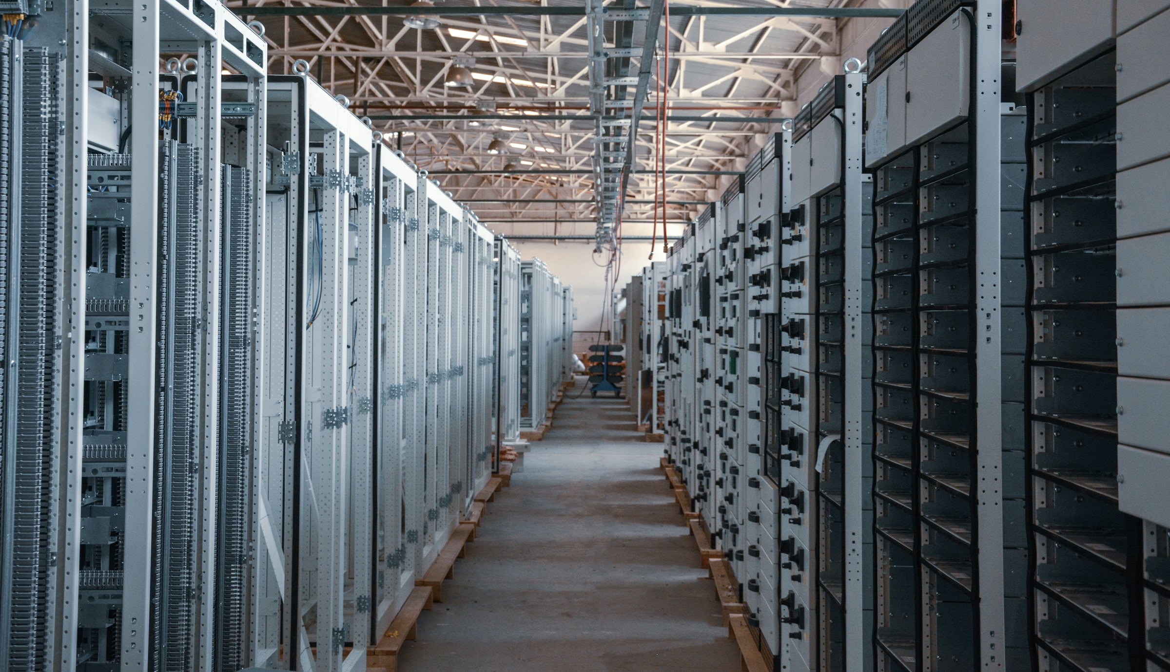 Long data centre aisle between server racks
